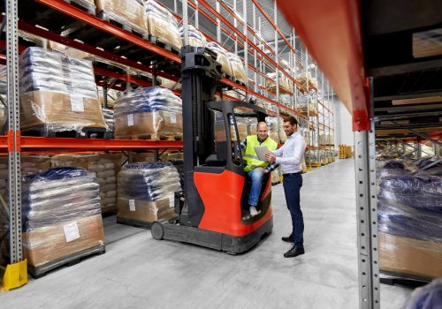 worker and businessman with tablet pc at warehouse logistic business, shipment and people concept - warehouse worker and businessman with tablet pc computer and tablet pc computer
